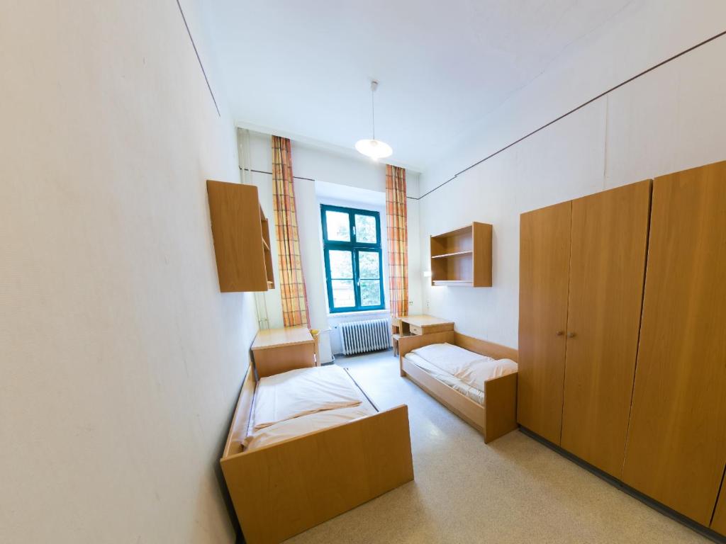 Postel nebo postele na pokoji v ubytování Porzellaneum