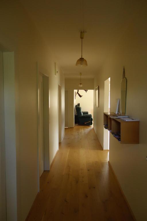 an empty room with a long hallway with at Thorbrandsstadir Farm Holidays in Þorbrandsstaðir
