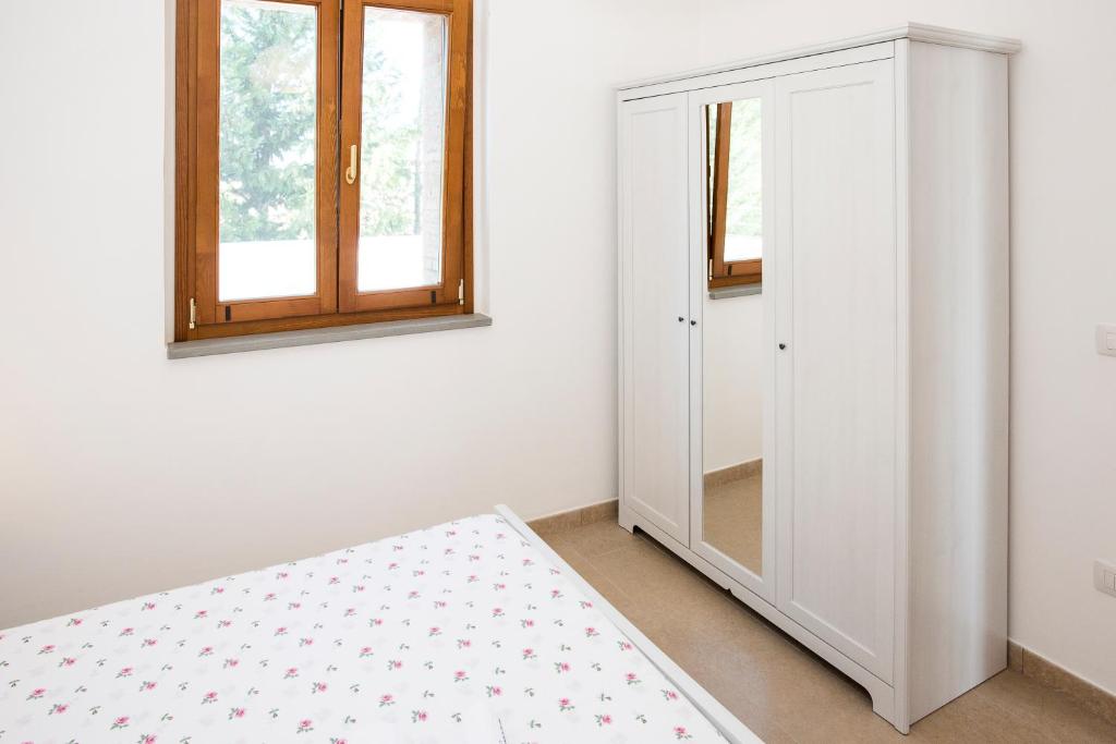 Postel nebo postele na pokoji v ubytování Il Delfino