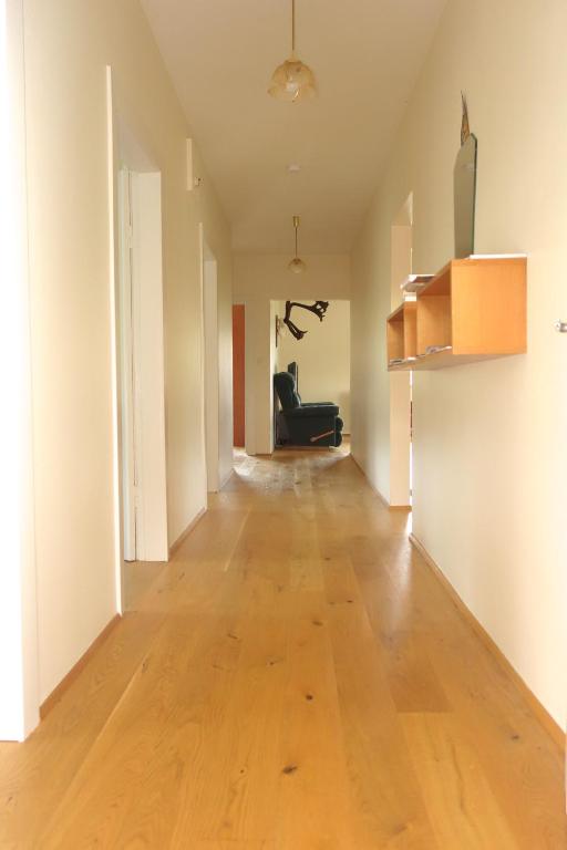 an empty hallway in an apartment with a hard wood floor at Thorbrandsstadir Farm Holidays in Þorbrandsstaðir