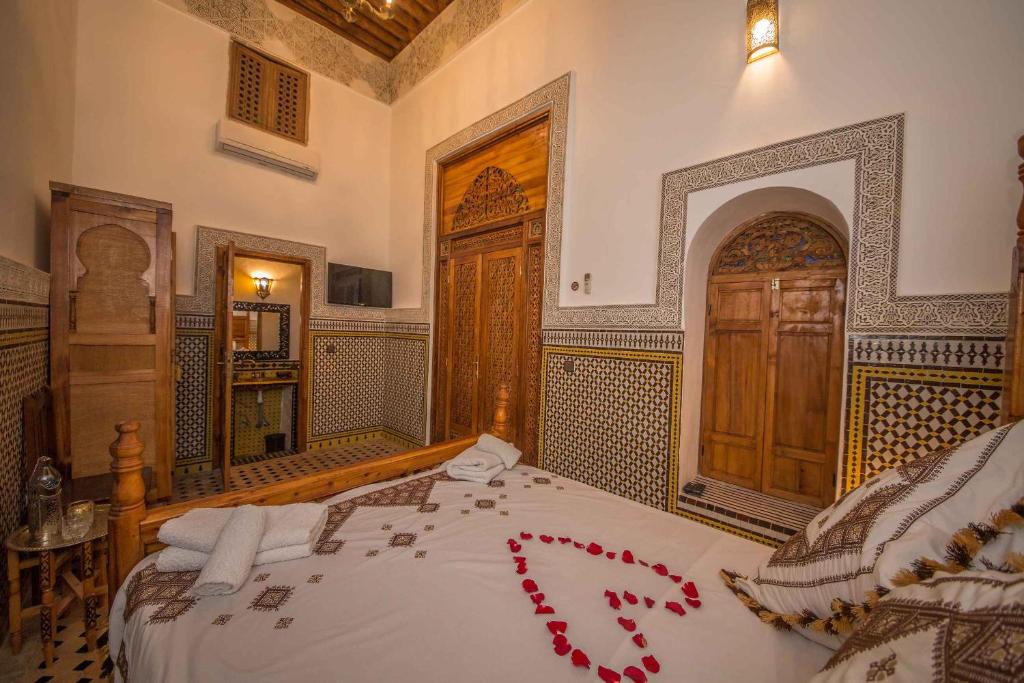 Postel nebo postele na pokoji v ubytování Riad Ouliya