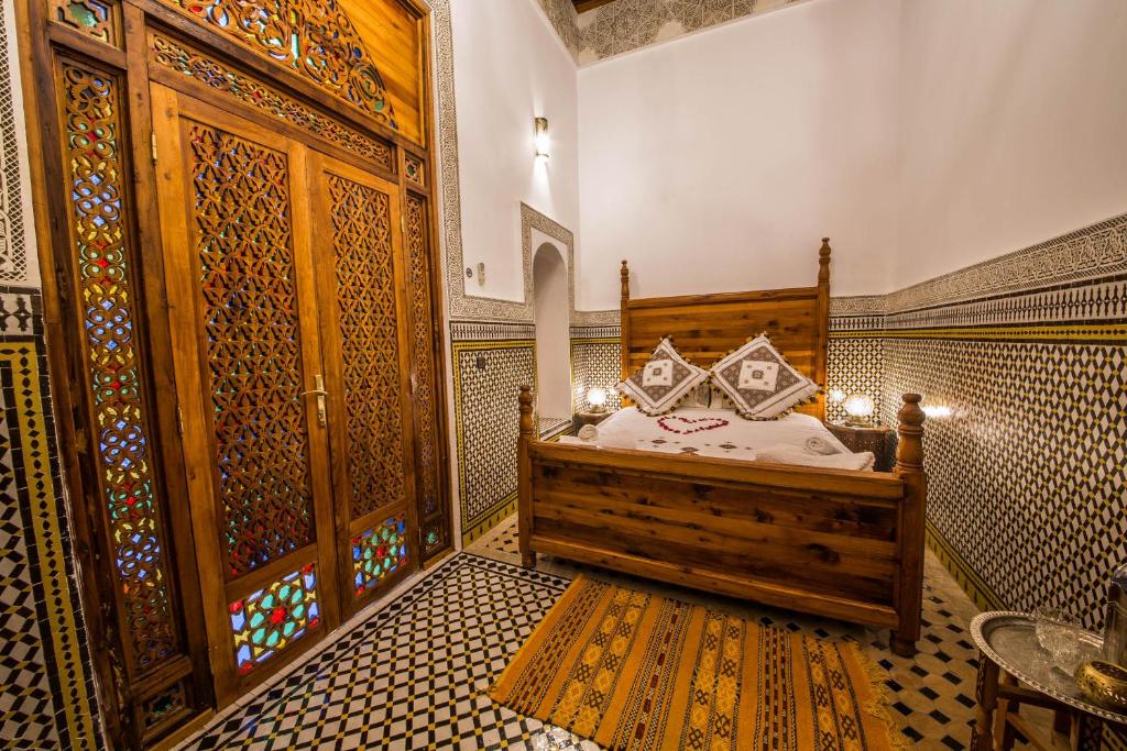 Postel nebo postele na pokoji v ubytování Riad Ouliya