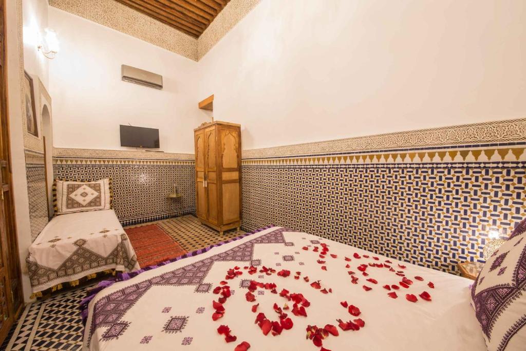 Postel nebo postele na pokoji v ubytování Riad Ouliya
