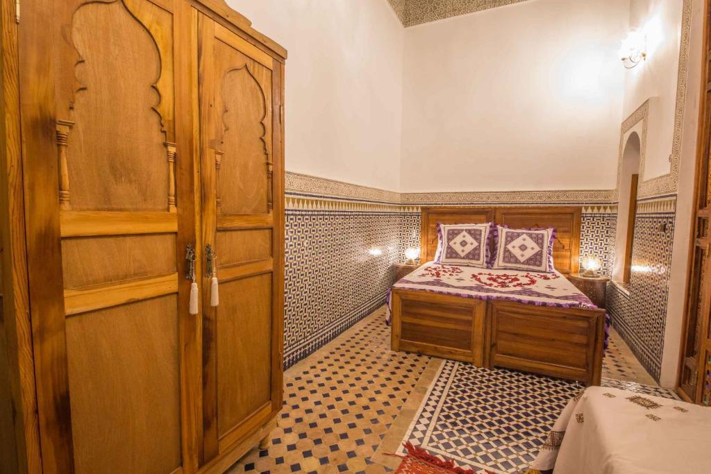 Postel nebo postele na pokoji v ubytování Riad Ouliya