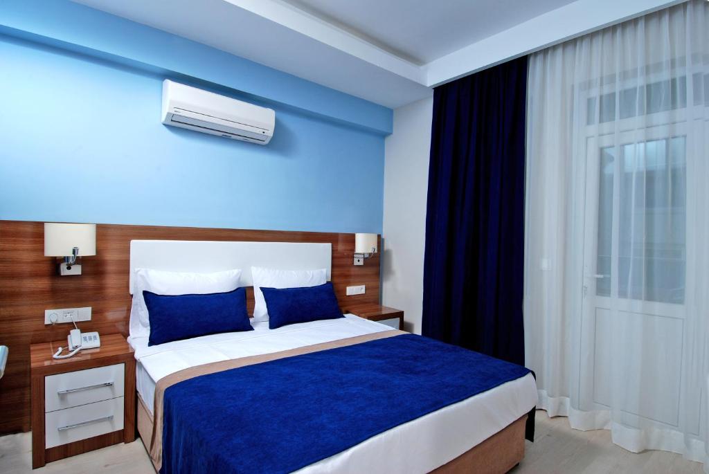 Postel nebo postele na pokoji v ubytování Kleopatra Ramira Hotel - All Inclusive