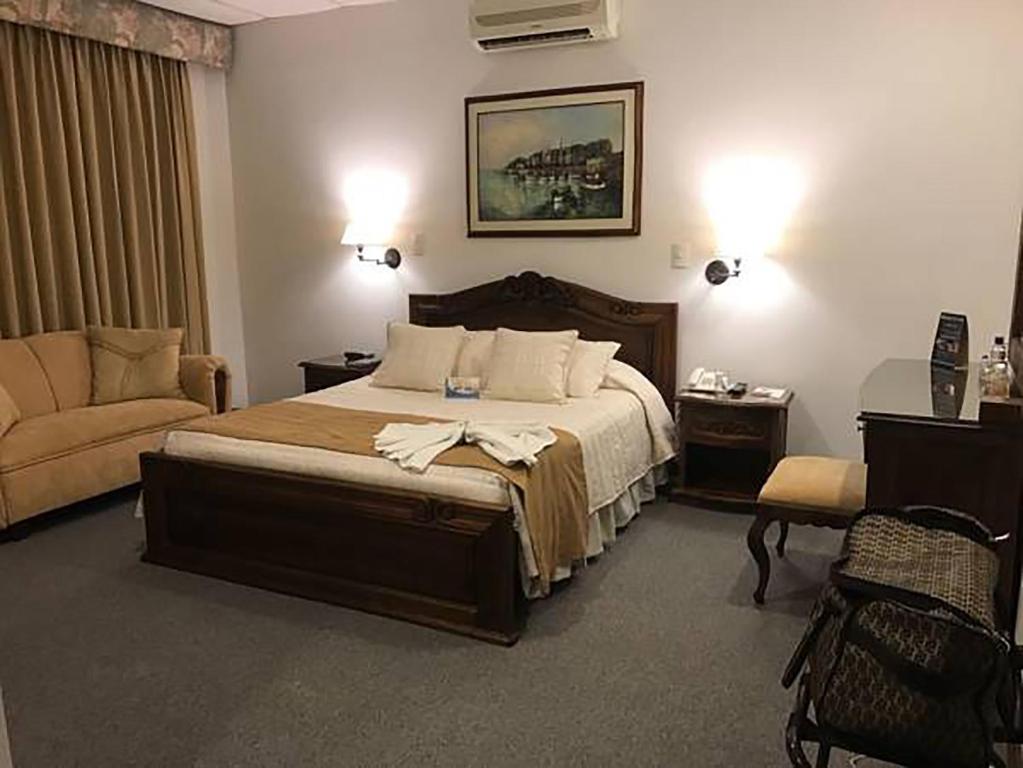 Postel nebo postele na pokoji v ubytování El Gran Hotel de Pereira