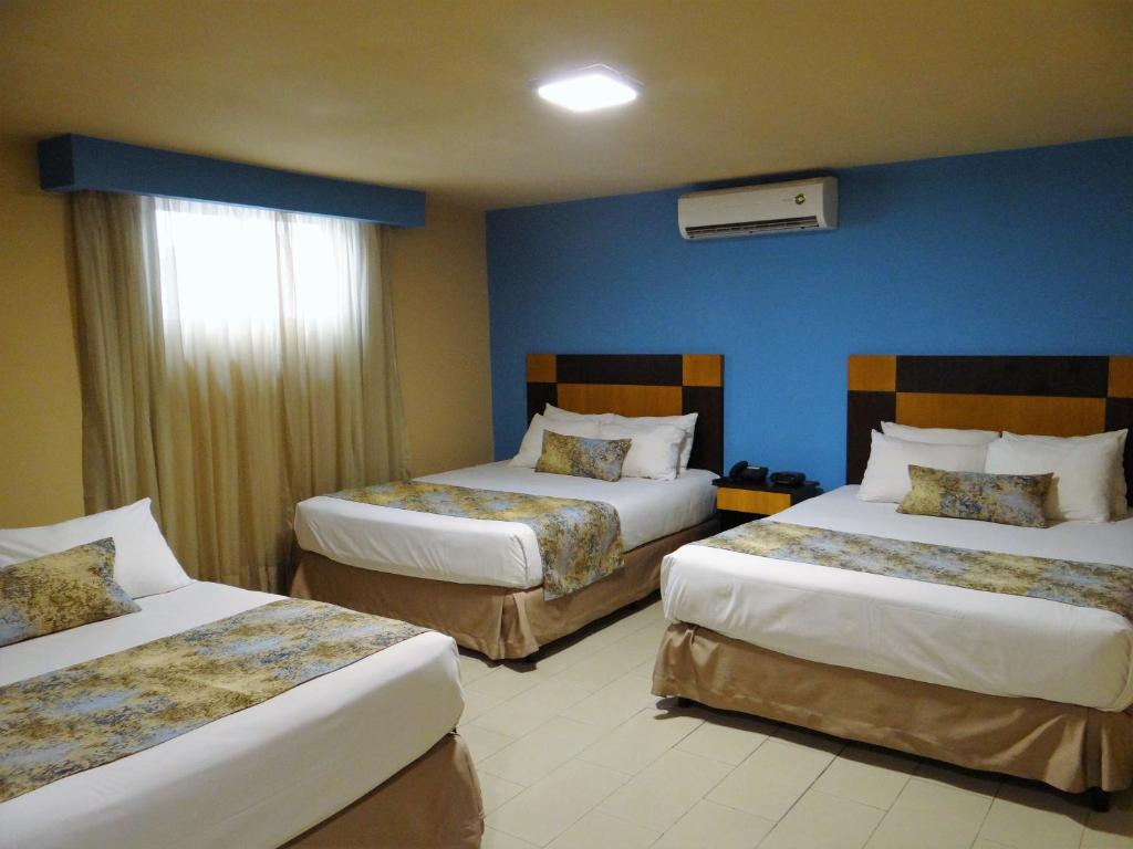 Postel nebo postele na pokoji v ubytování Metro Hotel Panama