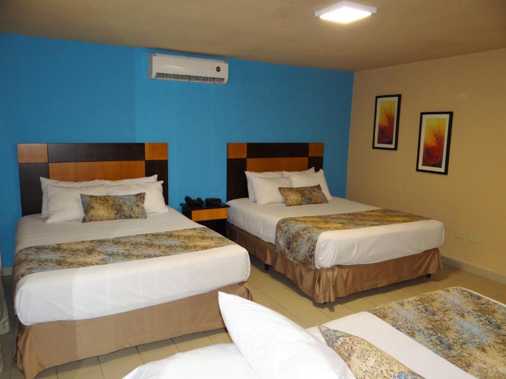 Postel nebo postele na pokoji v ubytování Metro Hotel Panama
