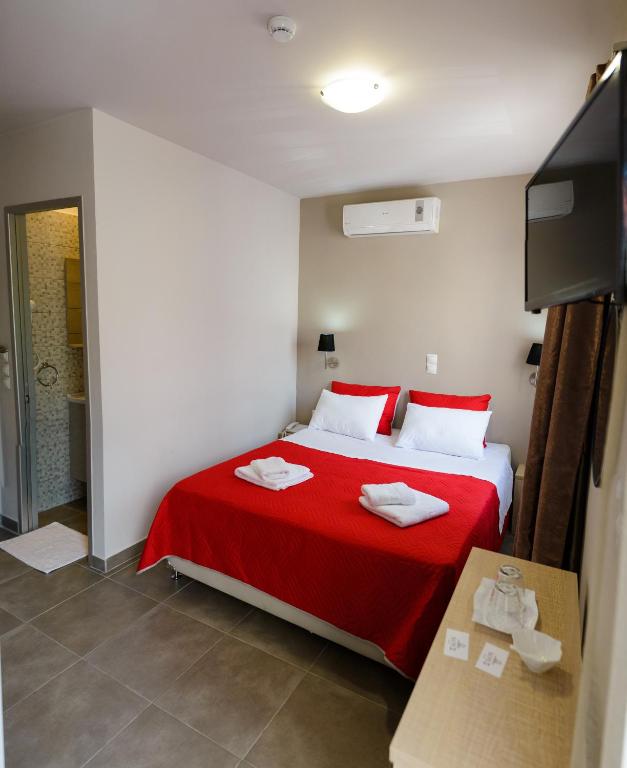 Ένα ή περισσότερα κρεβάτια σε δωμάτιο στο LUX Hotel