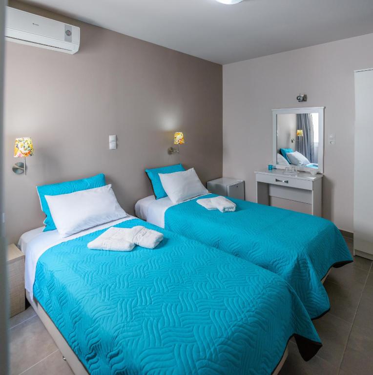 Ένα ή περισσότερα κρεβάτια σε δωμάτιο στο LUX Hotel