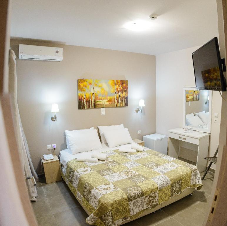 Ένα ή περισσότερα κρεβάτια σε δωμάτιο στο LUX Hotel