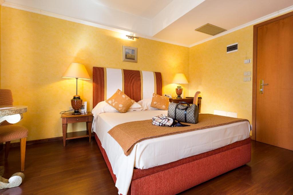 A bed or beds in a room at Bio Boutique Hotel XU' - Gruppo Ambienthotels