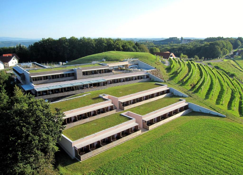 an overhead view of a building with green grass and trees at Genusshotel Riegersburg in Riegersburg