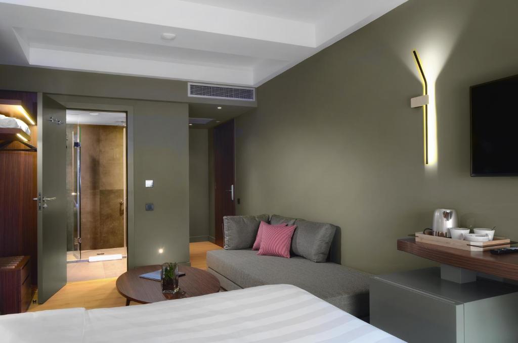 A bed or beds in a room at Lake Spirit Boutique Hotel & Spa