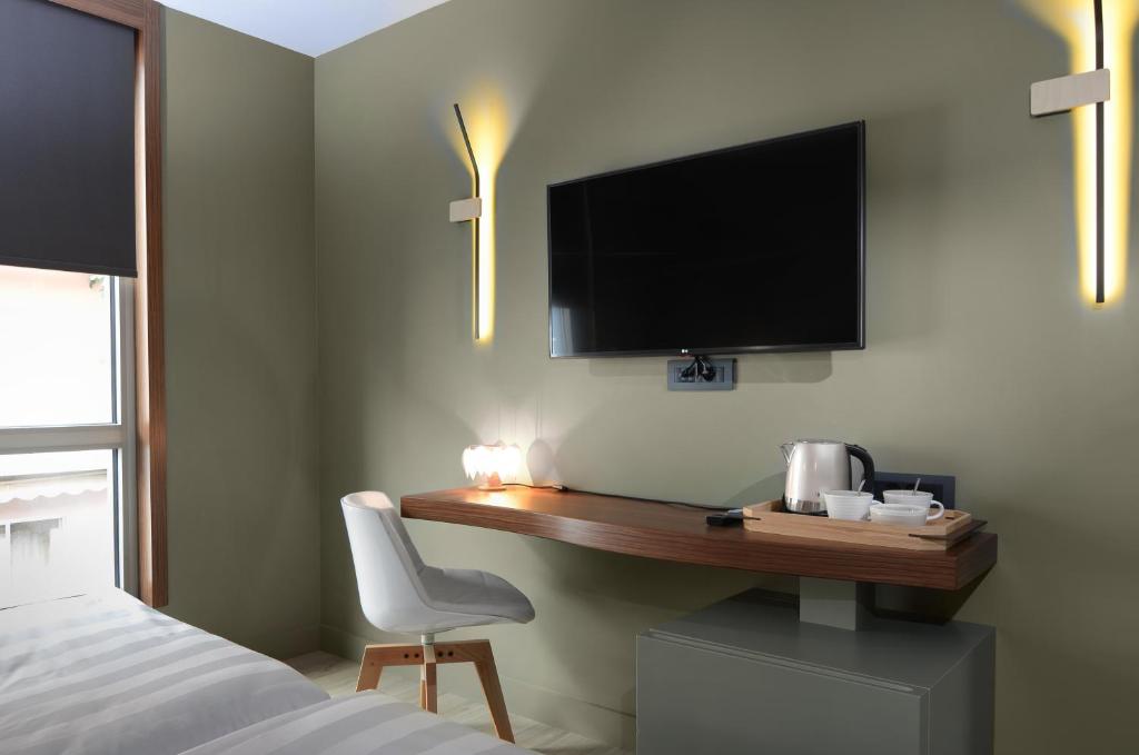 A television and/or entertainment centre at Lake Spirit Boutique Hotel & Spa