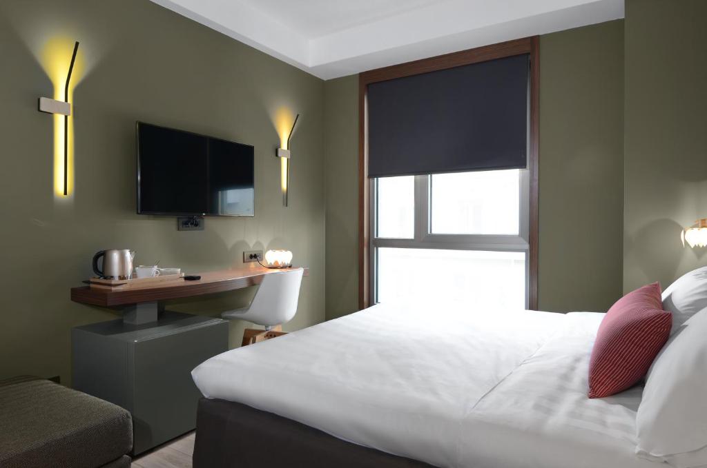 A bed or beds in a room at Lake Spirit Boutique Hotel & Spa