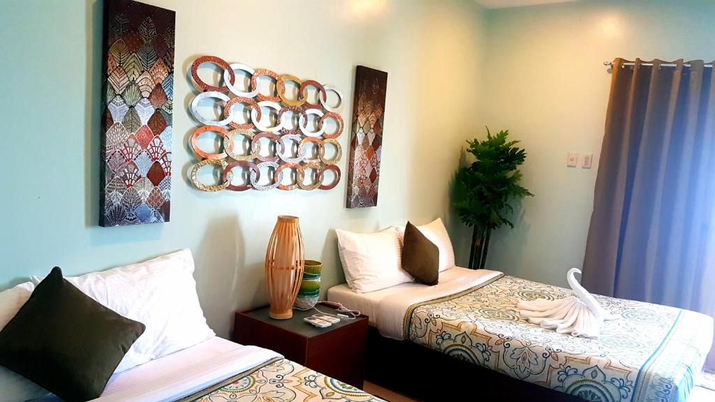Postel nebo postele na pokoji v ubytování Tropical Fun Ta Sea Rentals