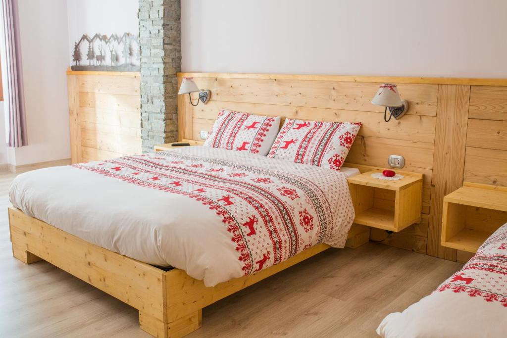 מיטה או מיטות בחדר ב-Albergo Rotenthal