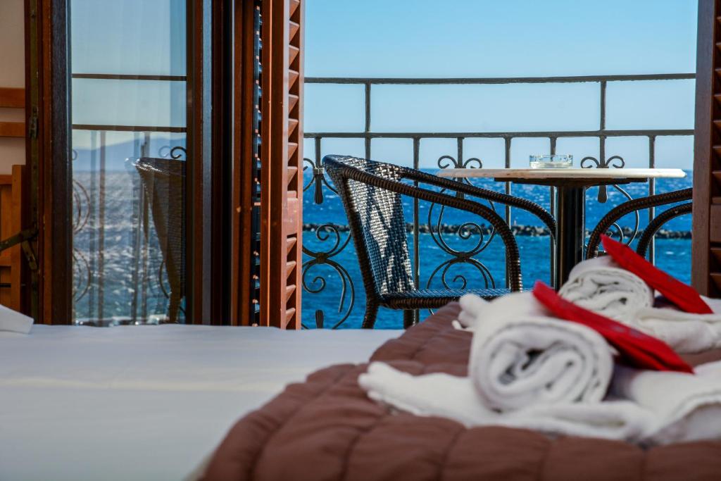 Postel nebo postele na pokoji v ubytování Poseidonio Hotel