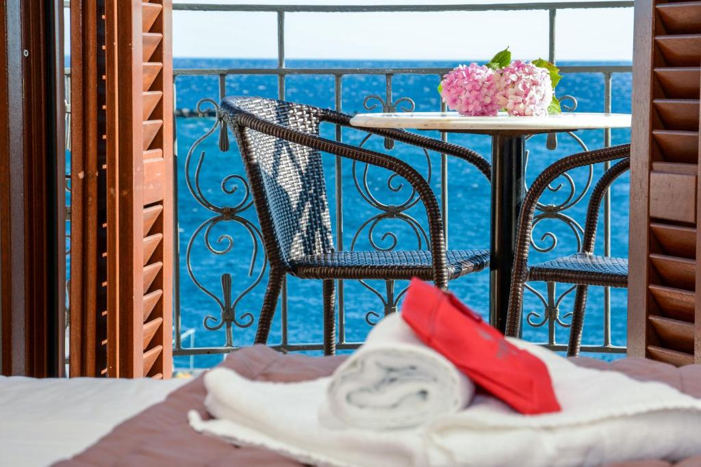 Postel nebo postele na pokoji v ubytování Poseidonio Hotel
