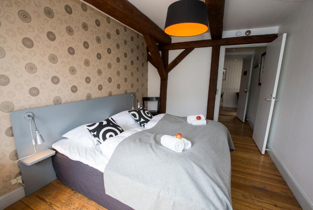 Postel nebo postele na pokoji v ubytování Hotel Saxkjøbing