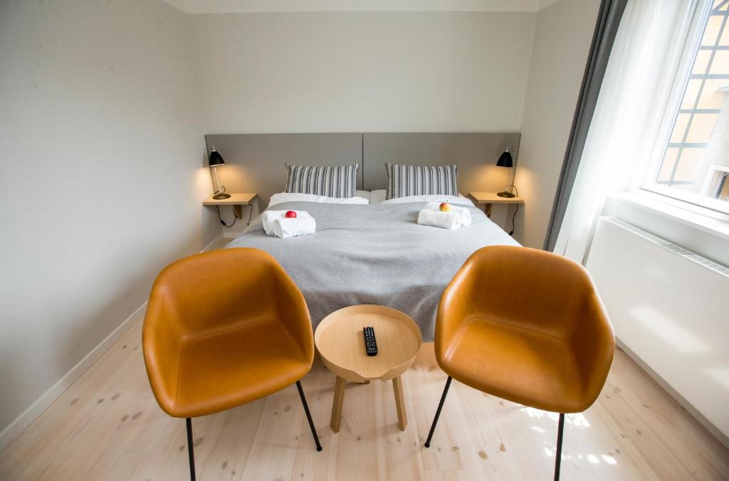 Postel nebo postele na pokoji v ubytování Hotel Saxkjøbing