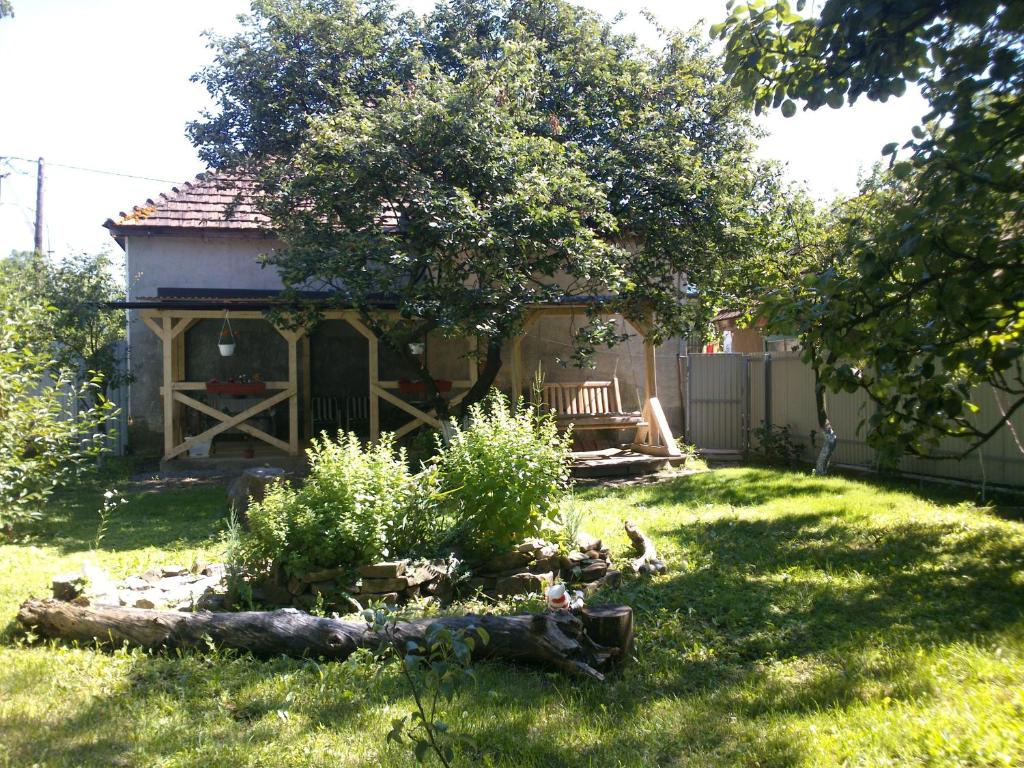 a gazebo with a bench in a yard at Villa Svalyavа in Svalyava