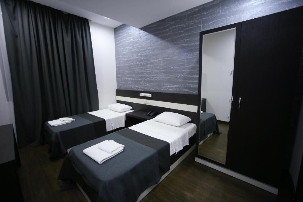 Voodi või voodid majutusasutuse West Tower Hotel toas