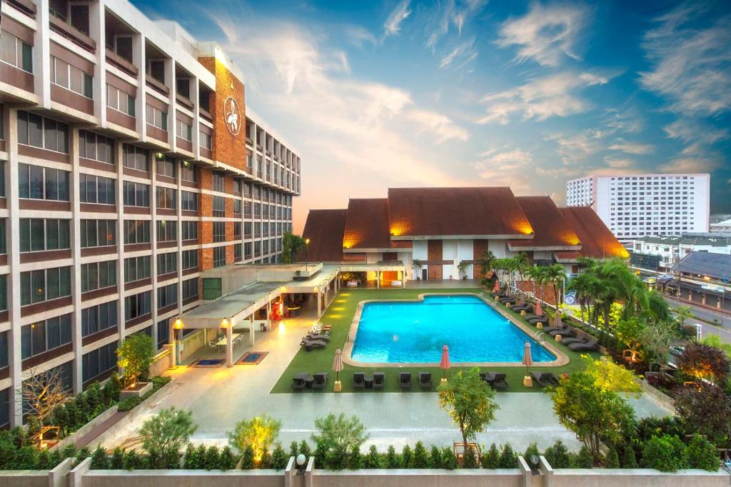 an overhead view of a building with a swimming pool at Chiang Mai Orchid Hotel SHA EXTRA PLUS in Chiang Mai