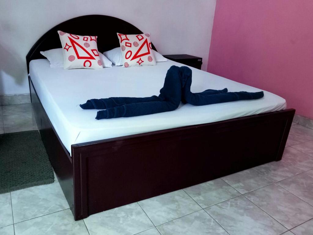Postel nebo postele na pokoji v ubytování Takeshi Inn