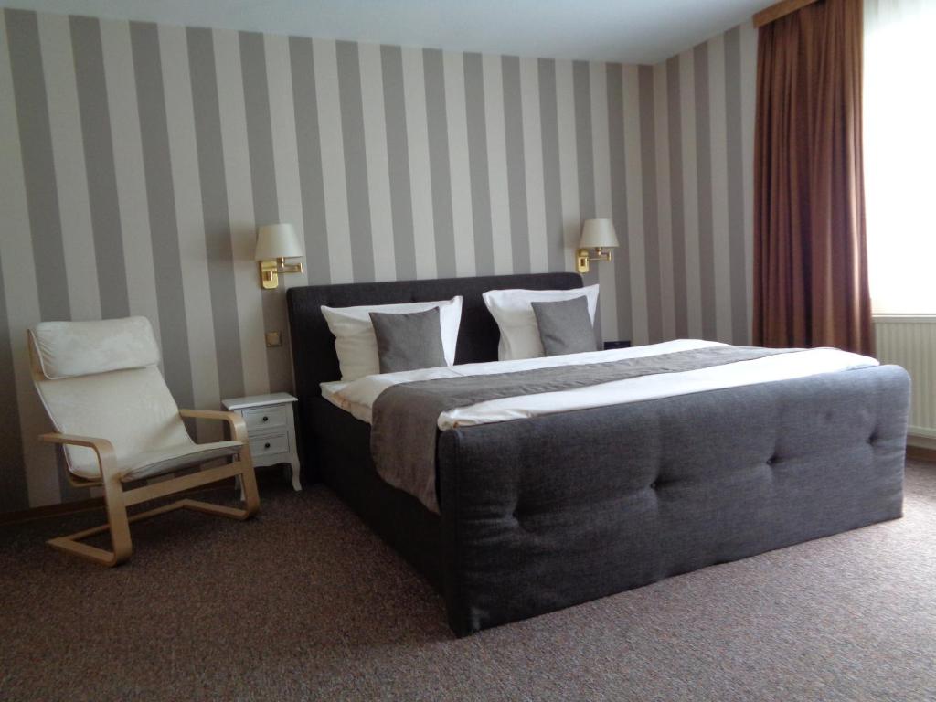 Postel nebo postele na pokoji v ubytování Hotel Garni Eichhornkobel