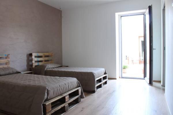 Postel nebo postele na pokoji v ubytování Amico Country House