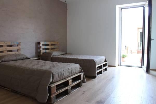 Postel nebo postele na pokoji v ubytování Amico Country House