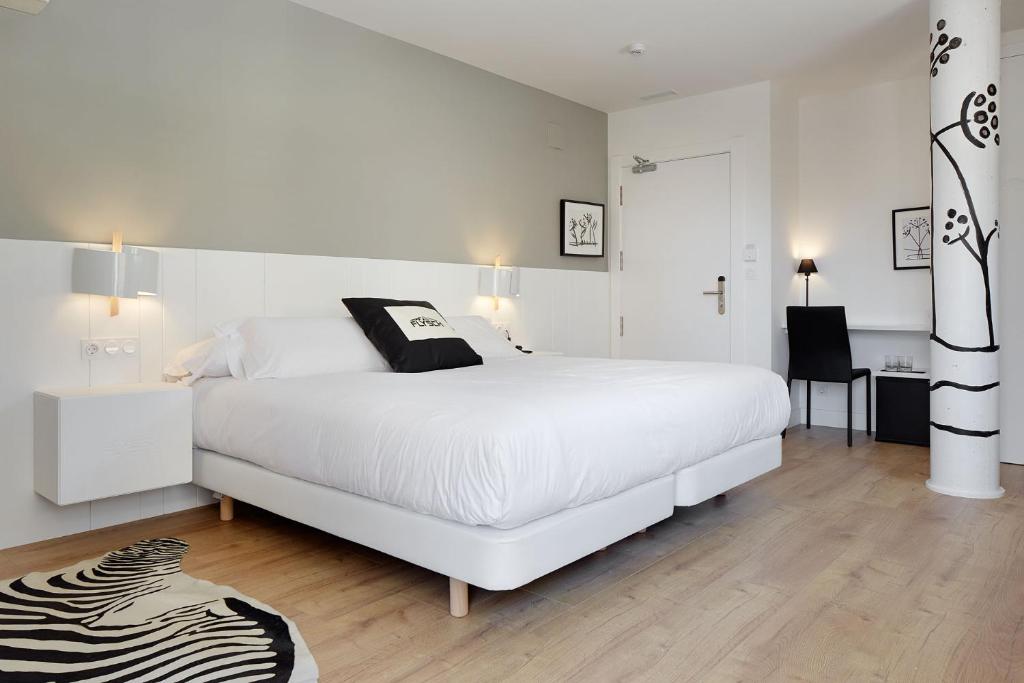 Postel nebo postele na pokoji v ubytování Hotel Flysch