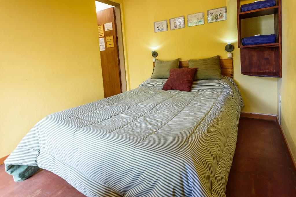 Postel nebo postele na pokoji v ubytování La Tosca Hostel
