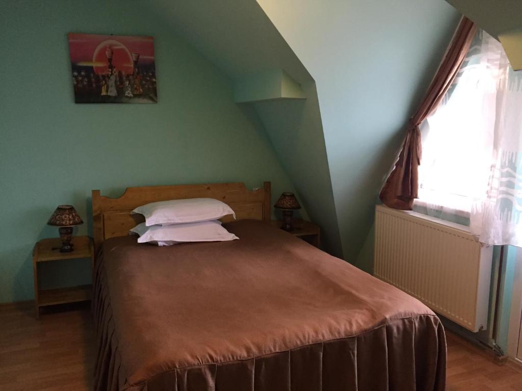 Postel nebo postele na pokoji v ubytování Pensiunea Aurora - Great Hostel Voineasa