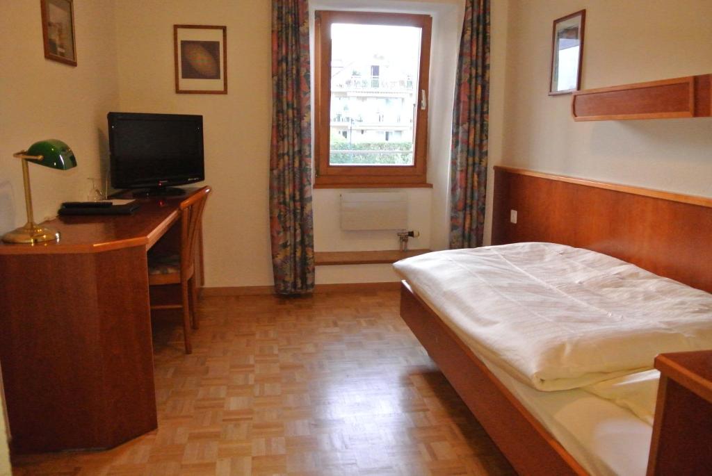 Postel nebo postele na pokoji v ubytování Auberge de la Réunion