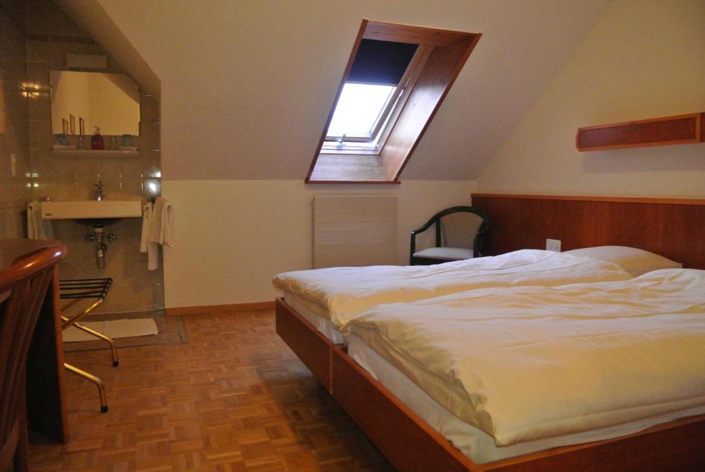 Ένα ή περισσότερα κρεβάτια σε δωμάτιο στο Auberge de la Réunion