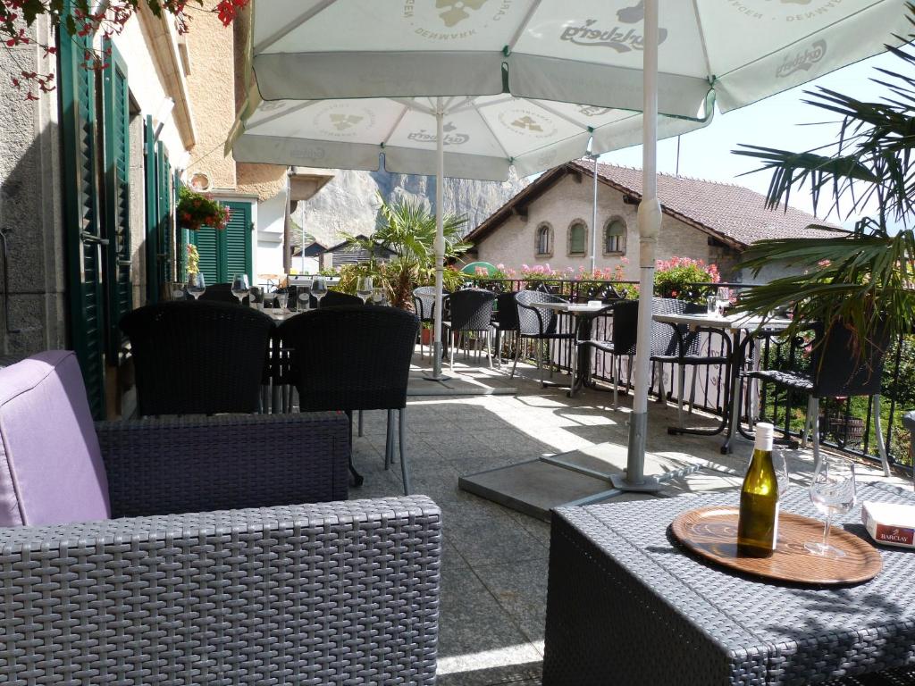 a bottle of wine sitting on a table with an umbrella at OH!Berge in Chamoson