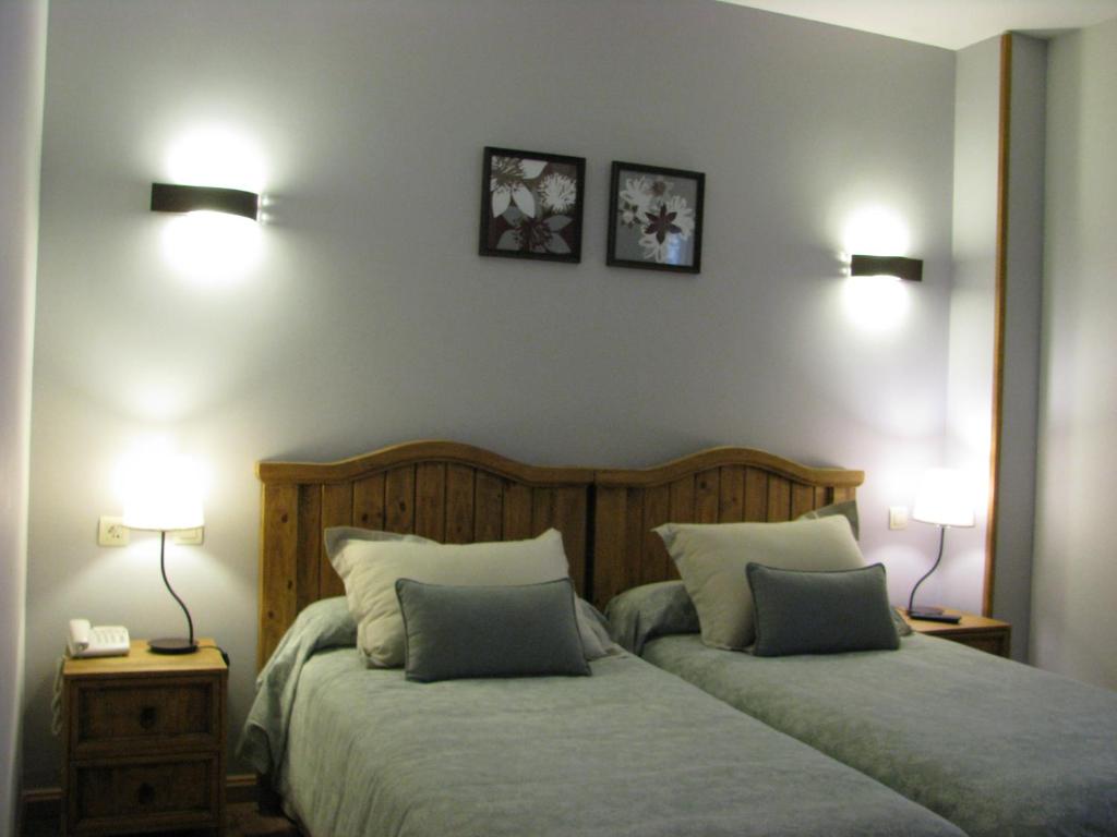 Postel nebo postele na pokoji v ubytování Aparthotel Sarrato