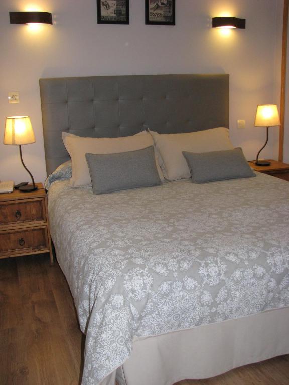 Postel nebo postele na pokoji v ubytování Aparthotel Sarrato