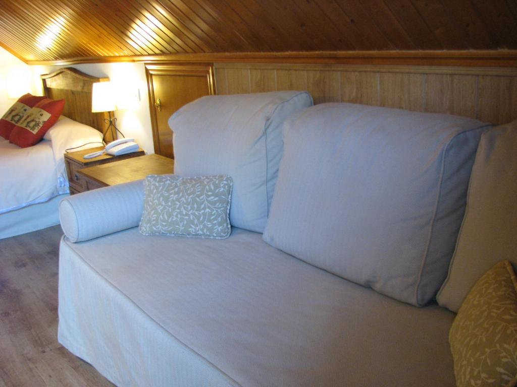 Postel nebo postele na pokoji v ubytování Aparthotel Sarrato