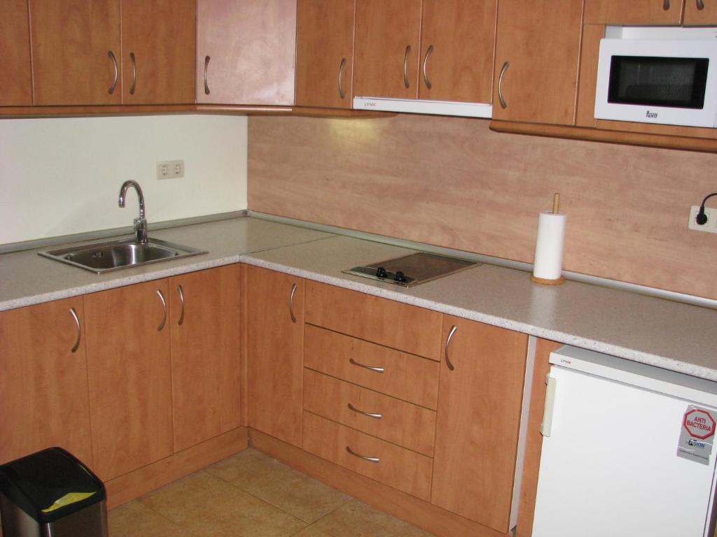 Kuchyň nebo kuchyňský kout v ubytování Aparthotel Sarrato