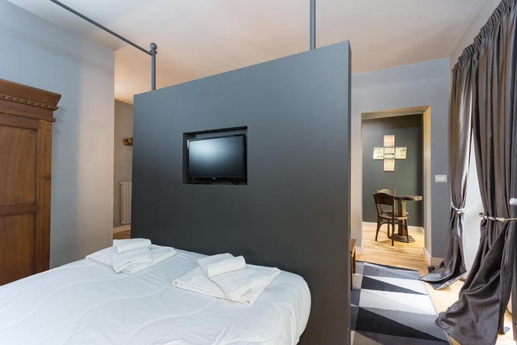 Posteľ alebo postele v izbe v ubytovaní Porta Palace Apartments