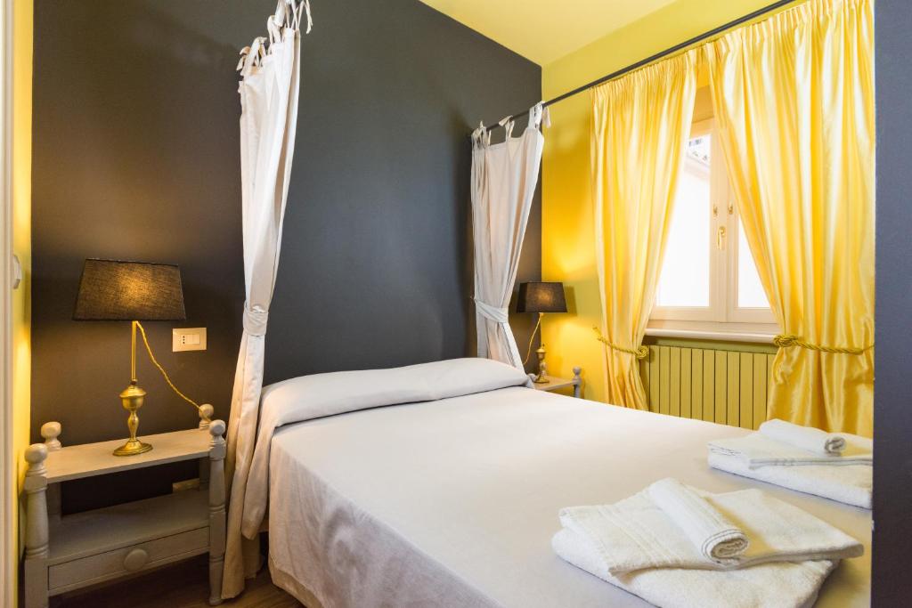 Posteľ alebo postele v izbe v ubytovaní Porta Palace Apartments