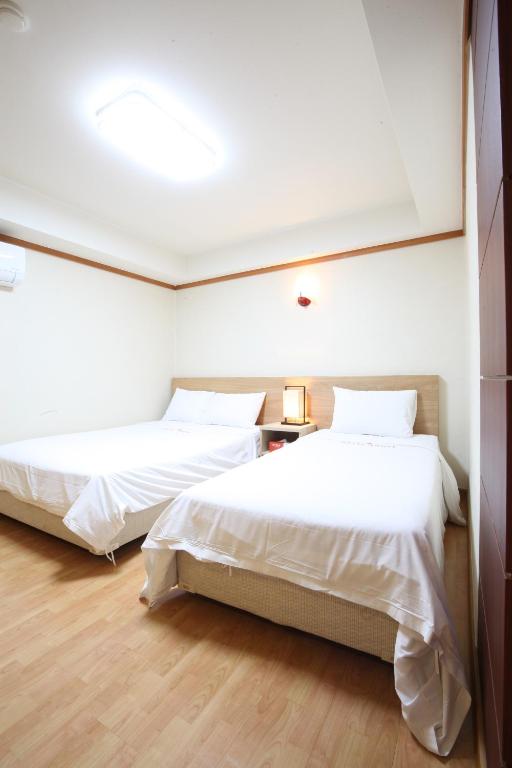 Postel nebo postele na pokoji v ubytování Angel Hotel