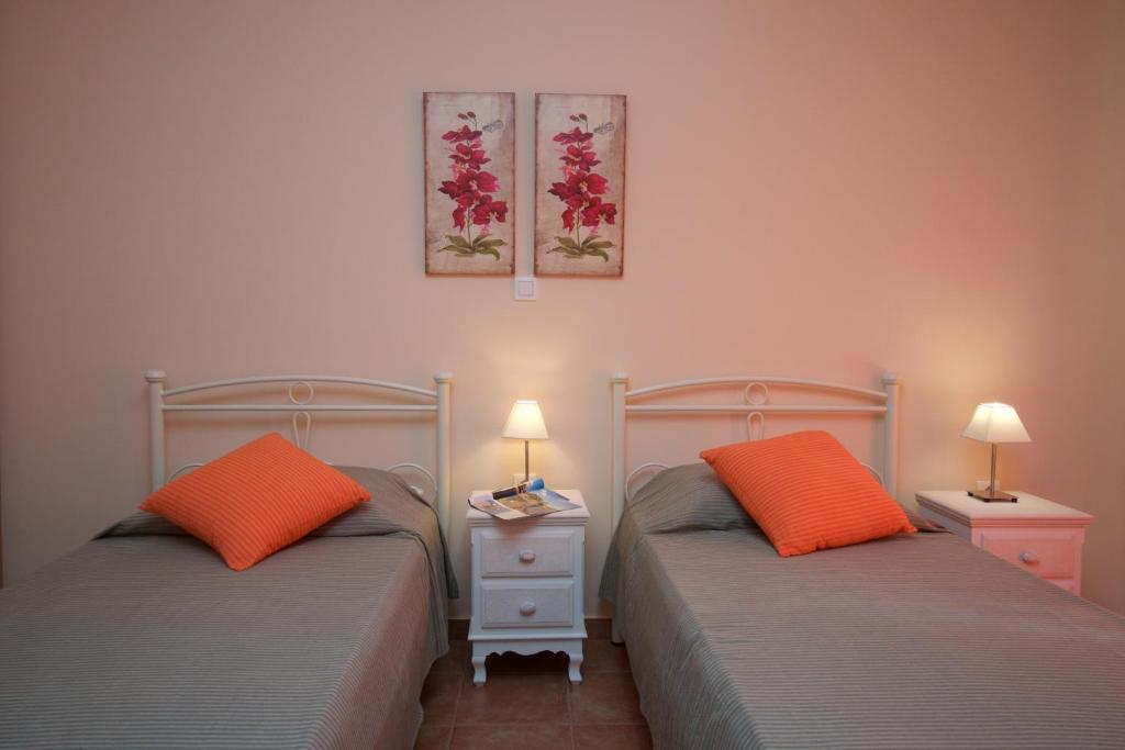 A bed or beds in a room at Villa REGINA