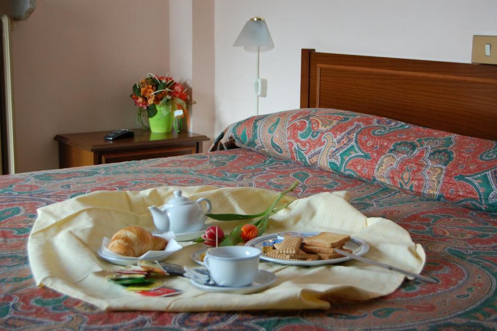Postel nebo postele na pokoji v ubytování Albergo Sud America