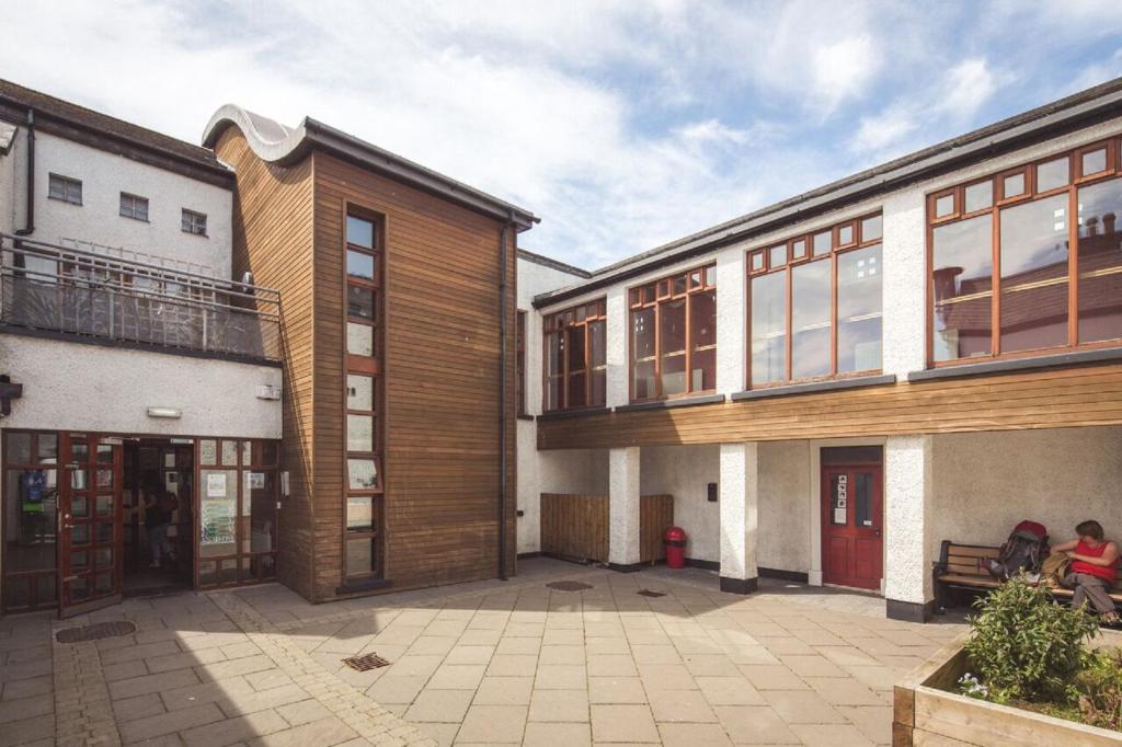 a group of buildings in a courtyard at Bushmills Youth Hostel in Bushmills