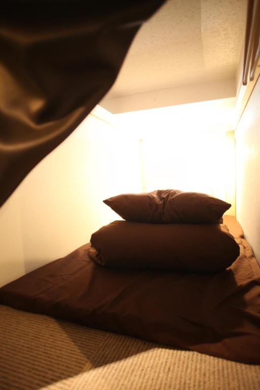Postel nebo postele na pokoji v ubytování Base Inn Tabata